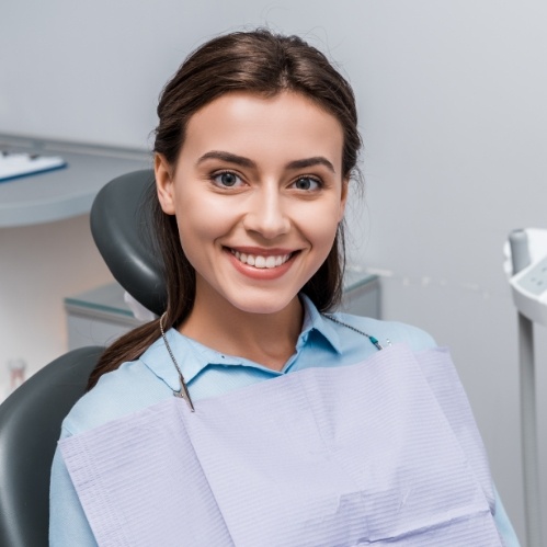 Smiling woman sitting in dental chair