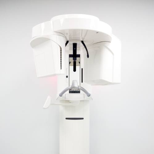 Dental scanning machine standing against white wall