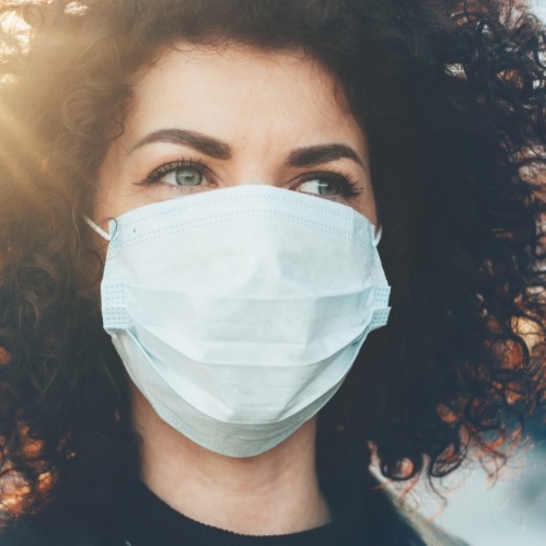 Woman wearing a face mask outdoors