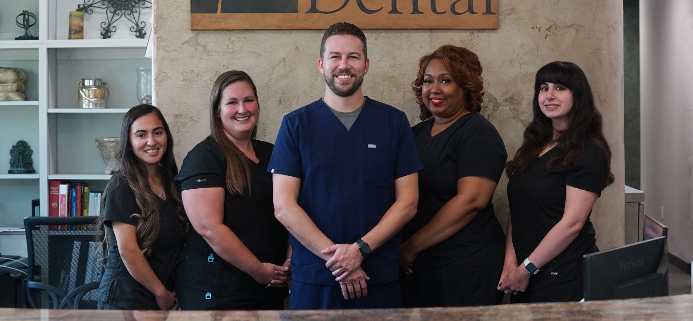 Carrollton dentist and team members at Flower Dental smiling