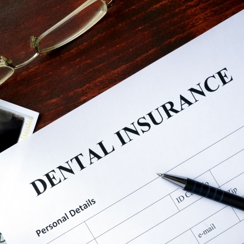 Dental insurance paperwork on desk